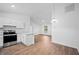 Kitchen and living room featuring quartz counters and stainless appliances at 430 Spring Dr, Ocala, FL 34472