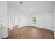 Bright living room with wood-look flooring and natural light at 430 Spring Dr, Ocala, FL 34472