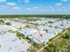 Aerial view of home in residential neighborhood with community lake, pool, and walking trails at 484 Landshark Blvd, Daytona Beach, FL 32124