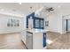 Open-concept kitchen featuring an island with stainless steel appliances, and vaulted ceiling at 484 Landshark Blvd, Daytona Beach, FL 32124