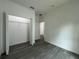 Bedroom with wood floors, walk-in closet and neutral walls at 516 Model St, Daytona Beach, FL 32114
