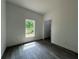 Bedroom featuring wood floors and lots of natural light at 516 Model St, Daytona Beach, FL 32114