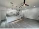 Bright, open-concept kitchen with granite countertops, a kitchen island and stainless steel appliances at 516 Model St, Daytona Beach, FL 32114