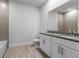 Elegant bathroom featuring double sink vanity with granite countertop and modern fixtures at 561 Coronado Cove Road, New Smyrna Beach, FL 32168