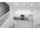 Kitchen with granite counters, white cabinets, and stainless appliances at 561 Coronado Cove Road, New Smyrna Beach, FL 32168
