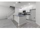 Open kitchen with stainless steel appliances and granite countertops at 561 Coronado Cove Road, New Smyrna Beach, FL 32168