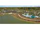 Beautiful aerial view of a community with a pool, clubhouse, and manicured landscaping at 5610 Nw 37Th Lane Rd, Ocala, FL 34482