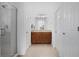 Bathroom featuring a double sink, shower, and ample storage space at 5610 Nw 37Th Lane Rd, Ocala, FL 34482