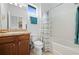 Well-lit bathroom features a vanity with counter space and a shower-tub combination, perfect for relaxation at 5610 Nw 37Th Lane Rd, Ocala, FL 34482