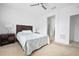 Comfortable bedroom featuring neutral carpet and two nightstands at 5610 Nw 37Th Lane Rd, Ocala, FL 34482
