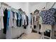 Walk-in closet with ample hanging space and shelving for organized storage at 5610 Nw 37Th Lane Rd, Ocala, FL 34482