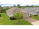 Well-maintained home featuring a two-car garage and nicely landscaped front yard at 5610 Nw 37Th Lane Rd, Ocala, FL 34482