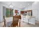 Cozy eat-in kitchen with stainless steel appliances and a breakfast bar at 5610 Nw 37Th Lane Rd, Ocala, FL 34482