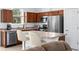 Modern kitchen with stainless steel appliances and a center island at 5610 Nw 37Th Lane Rd, Ocala, FL 34482