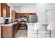 Modern kitchen featuring stainless steel appliances, granite countertops, and a breakfast bar for casual dining at 5610 Nw 37Th Lane Rd, Ocala, FL 34482