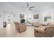 Spacious living room featuring tile floors, large windows, and comfortable seating at 5610 Nw 37Th Lane Rd, Ocala, FL 34482