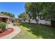 Expansive backyard with a privacy fence, well-manicured lawn, and a screened patio area at 585 Summerhaven Dr, Debary, FL 32713