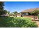 Spacious backyard with lush green lawn, brick accents, and inviting outdoor space at 585 Summerhaven Dr, Debary, FL 32713