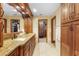 Elegant bathroom features a granite countertop, double sinks, and custom wood cabinets at 585 Summerhaven Dr, Debary, FL 32713