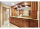 Luxurious bathroom with custom cabinetry, double sinks, and elegant marble flooring at 585 Summerhaven Dr, Debary, FL 32713