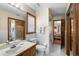 Bathroom with tile flooring, white fixtures, and wood vanity with ample mirror space at 585 Summerhaven Dr, Debary, FL 32713