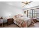 Inviting bedroom with floral bedding, natural light, and traditional furnishings at 585 Summerhaven Dr, Debary, FL 32713
