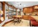 Inviting dining area with wood table and chairs, bright lighting, and a large window at 585 Summerhaven Dr, Debary, FL 32713