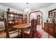 Charming dining room boasts a classic wood table, ornate chairs, and display cabinetry at 585 Summerhaven Dr, Debary, FL 32713