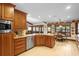 Beautiful kitchen with wood cabinetry, stainless appliances, and breakfast nook at 585 Summerhaven Dr, Debary, FL 32713