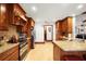 Spacious kitchen with custom cabinetry, granite countertops, and stainless steel appliances at 585 Summerhaven Dr, Debary, FL 32713