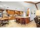 Well-appointed kitchen with wood cabinetry, granite countertops, and a central island at 585 Summerhaven Dr, Debary, FL 32713
