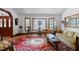Cozy living room with vintage rug, bay window, and comfortable seating at 585 Summerhaven Dr, Debary, FL 32713