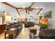 Spacious living room featuring vaulted ceilings, a ceiling fan, and comfortable seating at 585 Summerhaven Dr, Debary, FL 32713