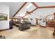 Open-concept living room with vaulted ceilings, skylights, tile flooring, and comfortable seating at 585 Summerhaven Dr, Debary, FL 32713