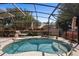 Cozy screened-in pool with lounge chair, perfect for relaxation and outdoor enjoyment at 585 Summerhaven Dr, Debary, FL 32713