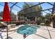 Inviting kidney shaped pool within screened lanai with lounge chairs and decorative yard accents at 585 Summerhaven Dr, Debary, FL 32713