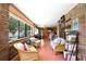 Bright sun room offers natural light, brick accents, and plenty of space for relaxing or entertaining at 585 Summerhaven Dr, Debary, FL 32713