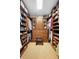Spacious walk-in closet with custom shelving, drawers, and ample storage at 585 Summerhaven Dr, Debary, FL 32713