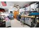 Functional workshop featuring diamond plate cabinets, workbench, and ample storage options for tools and equipment at 585 Summerhaven Dr, Debary, FL 32713