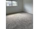 Spacious bedroom with carpeting, a window, and neutral walls at 600 N Boundary Ave # 114-C, Deland, FL 32720