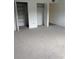 Bedroom with closets and carpeting at 600 N Boundary Ave # 114-C, Deland, FL 32720