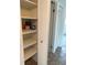 Linen closet with shelving and a bi-fold door at 600 N Boundary Ave # 114-C, Deland, FL 32720