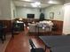 Community room seating area with tables and tv at 600 N Boundary Ave # 114-C, Deland, FL 32720