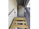 Wooden stairway leading to the second floor entrance, offering easy access to the upper level at 600 N Boundary Ave # 114-C, Deland, FL 32720
