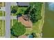 Aerial view of a home with beautiful landscaping and lake access at 61 Bryan Cave Rd, South Daytona, FL 32119