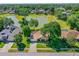 Aerial view of a home with a lake and lush green landscaping at 61 Bryan Cave Rd, South Daytona, FL 32119