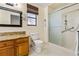 Bright bathroom features granite countertops, framed mirror, and tiled walk-in shower at 61 Bryan Cave Rd, South Daytona, FL 32119