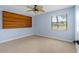 Bedroom with carpet floors, ceiling fan and built-in shelving and plenty of natural light at 61 Bryan Cave Rd, South Daytona, FL 32119