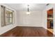 Dining room features hardwood floors, contemporary lighting, and natural light with easy access to the kitchen at 61 Bryan Cave Rd, South Daytona, FL 32119