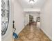 Inviting foyer with decorative tile flooring leading to the living area with a fireplace at 61 Bryan Cave Rd, South Daytona, FL 32119